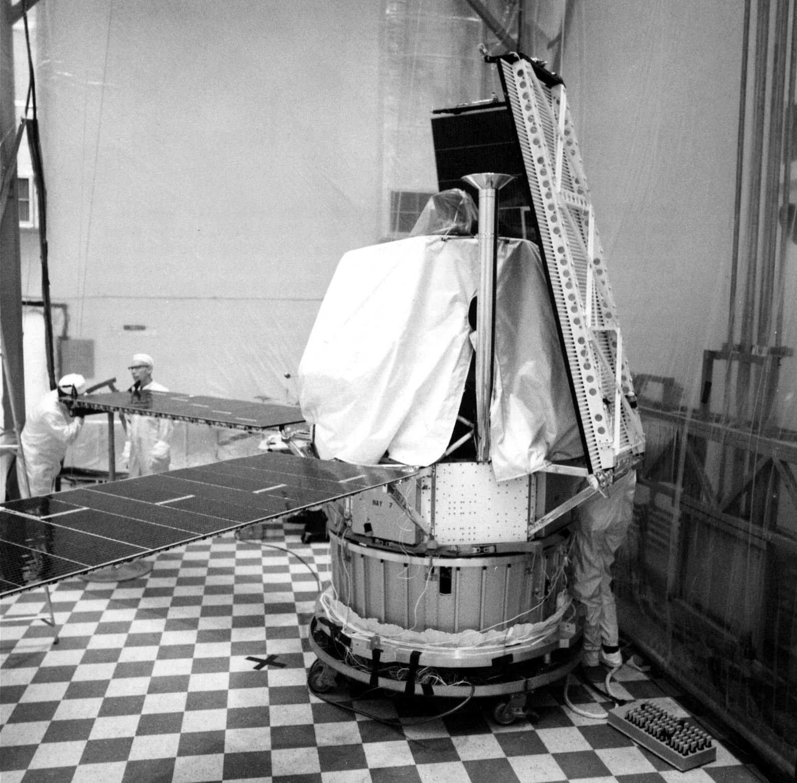 Technicians assembling the Mariner 8 spacecraft in a cleanroom